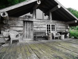 facade of weathered Log Cabin