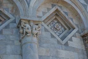 column with sculptures on the building