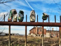 tin cans on the fence