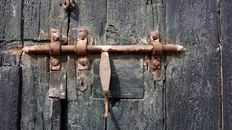 rusty latch on the wooden door