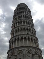 top of leaning Tower at cloudy sky, Italy, Tuscany, Pisa