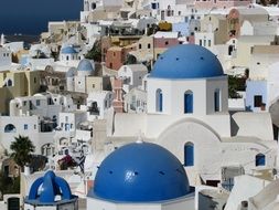 blue domes of churches on Santorini island, Greece