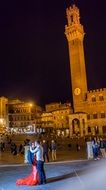 tourists on the square at night, italy, Tuscany, Siena