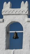 the bell on the wall of the tavern
