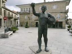 bronze statue in a square in spain