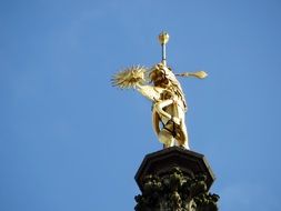 golden sculpture of the devil in arras