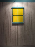 yellow window on a building wall