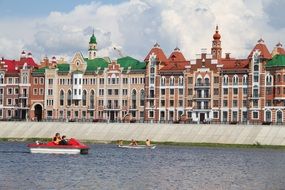 houses with colored roofs near the river