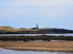 white lighthouse view from the beach