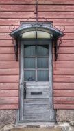 grey door in pink house