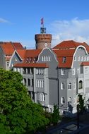 view of The Spremberg Tower from behind a gray building, germany, Cottbus