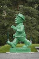 statue of a walking man in the park