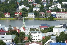 church and houses near the lake