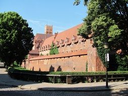 castle as a monument of architecture among the beautiful plants in poland