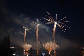 landscape of bright fireworks at the night city