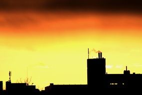 silhouettes of city buildings during sunrise