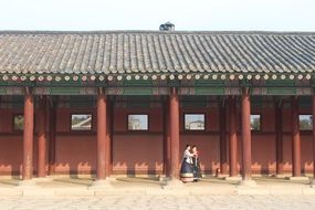 Chinese building and two girls