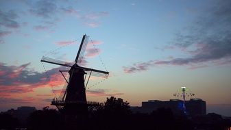 landscape of high windmill at the beautiful sunset