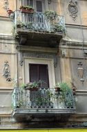 old house Balcony decorated with Flowers, Italy