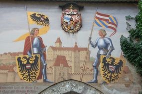 historical coat of arms painting on a wall
