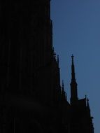 silhouette of spire of ulm cathedral at evening sky, germany, münster