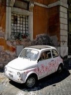 small white car with flowers