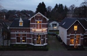 illuminated traditional Houses in Historical Town at dusk, netherlands