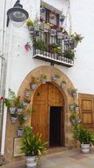 wooden entrance doors to a building in Javea, Spain