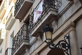 street lamp on the facade of an old building