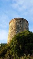 medieval tower on a green hill in spain