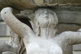 Woman Mermaid holding a fountain sculpture