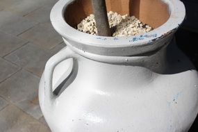 white outdoor vase on the street