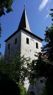 church spiers behind the trees