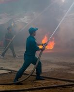 men extinguish a fire