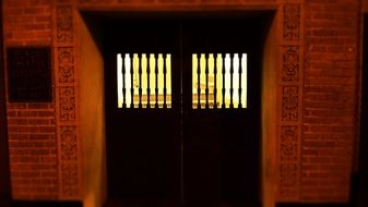 light through closed black doors