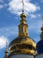 golden cross on a church roof