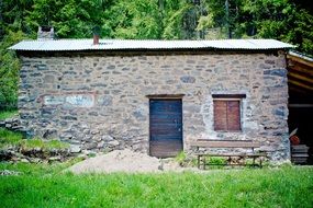 stone Alpine Hut at forest among the plants, germany, Schupf