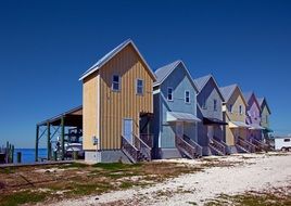 Row Of colorful Beach Houses in front of sea