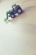 children's toy in the form of a tractor on the table