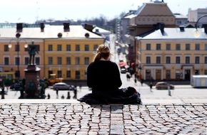 girl looks at the main square of the city