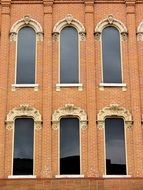 windows on the brick wall of the house