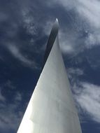 steel tower under the blue sky with clouds