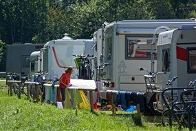 woman near trailers in Camping