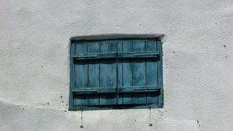 old house with blue shutters window in Aradippou