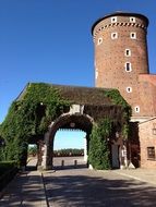 tower near the arched entrance to poland