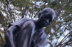 metal women statue in park