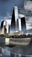 skyscrapers in new york under sky with clouds