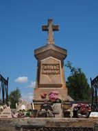 flowers and Grave Cross on Cemetery