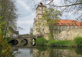 bridge over a river near a building in Germany