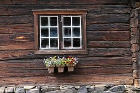 window in a wooden house in Roero, Norway